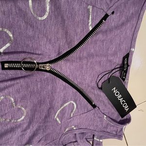 Noracora Womens short sleeve blouse. New in package. Size medium.